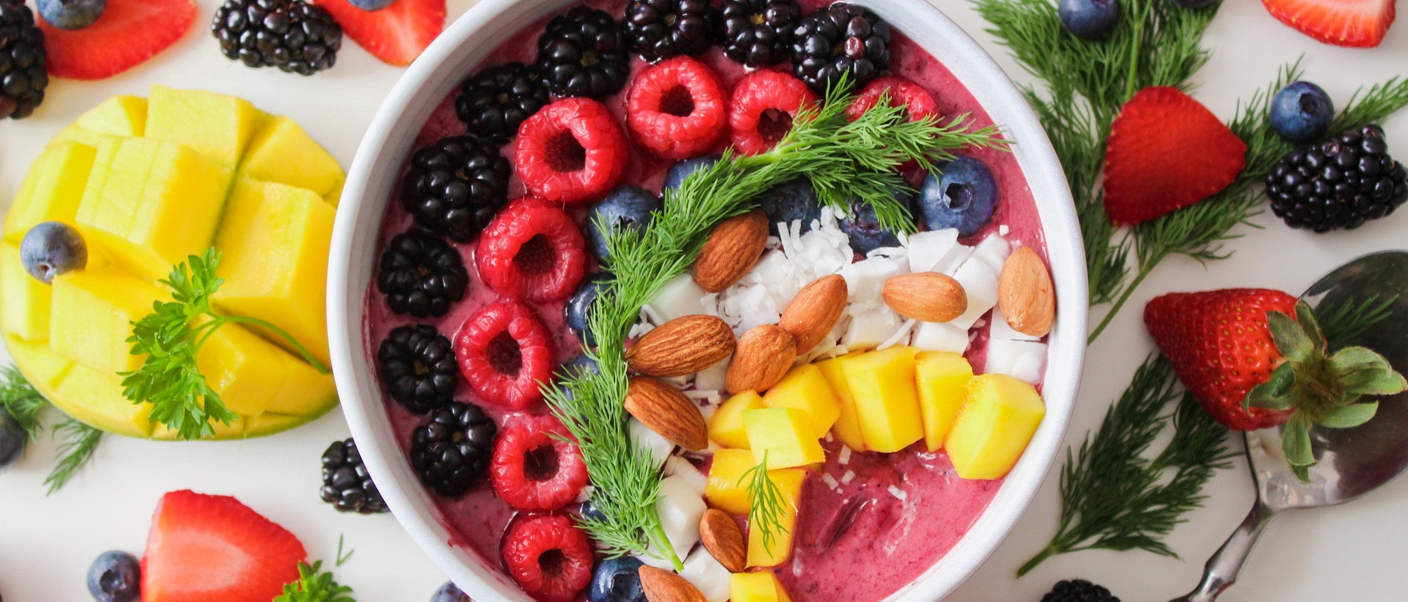 Variety of fruits and some iogurt in a bowl